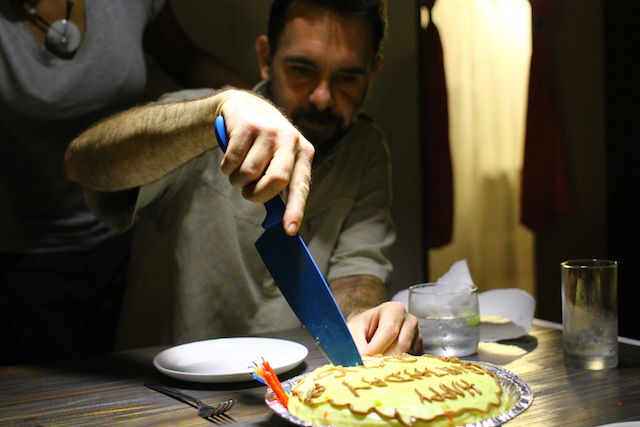 Doug cutting the passion fruit cake. 